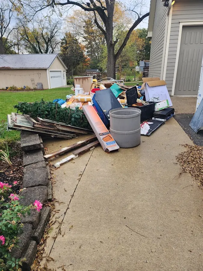 Dumpster being loaded with debris for Roofing Dumpster Rental in Kahaluu